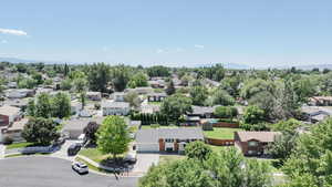 Aerial perspective of suburban area featuring a tree filled landscape