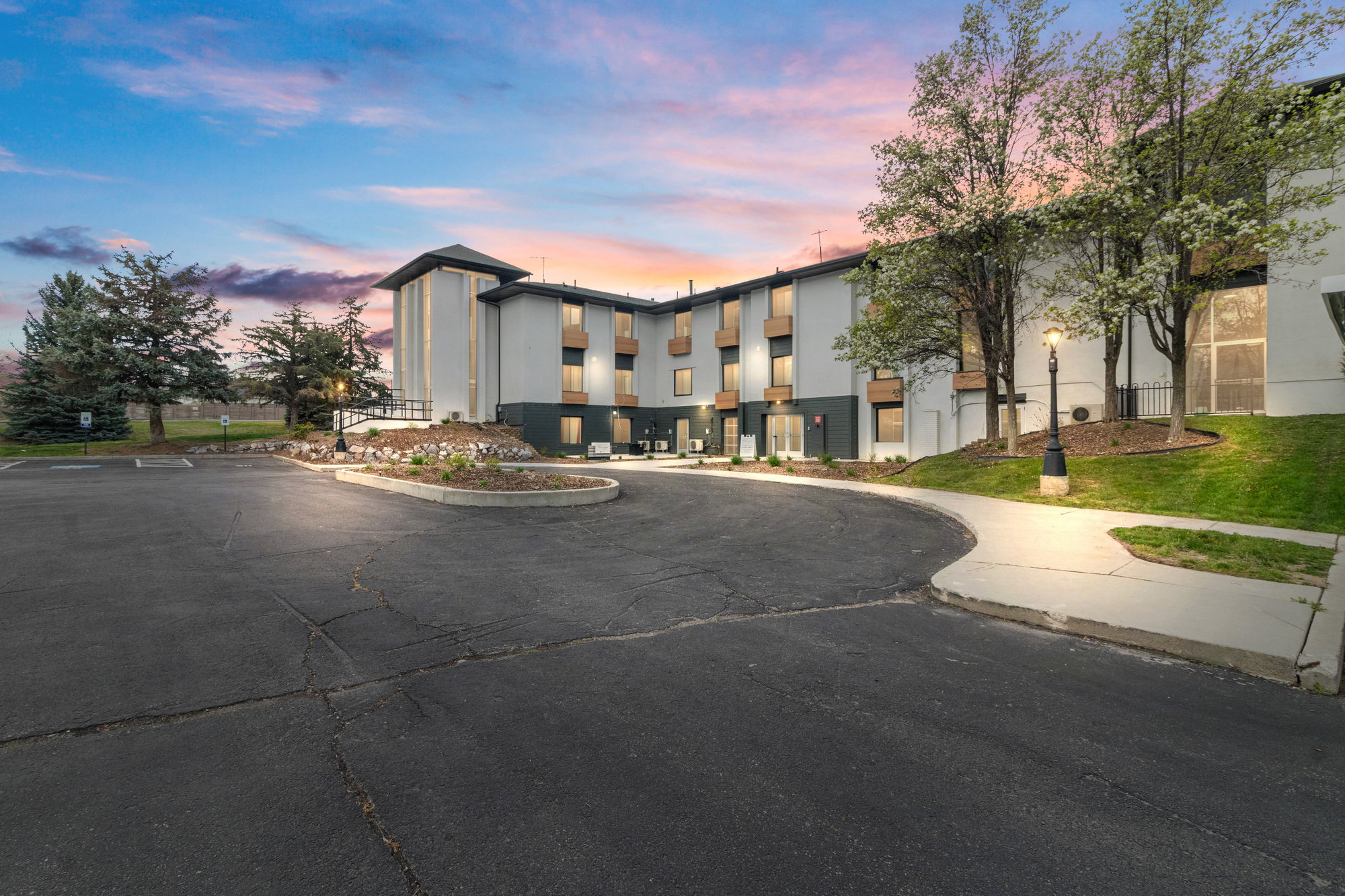 View of property at dusk