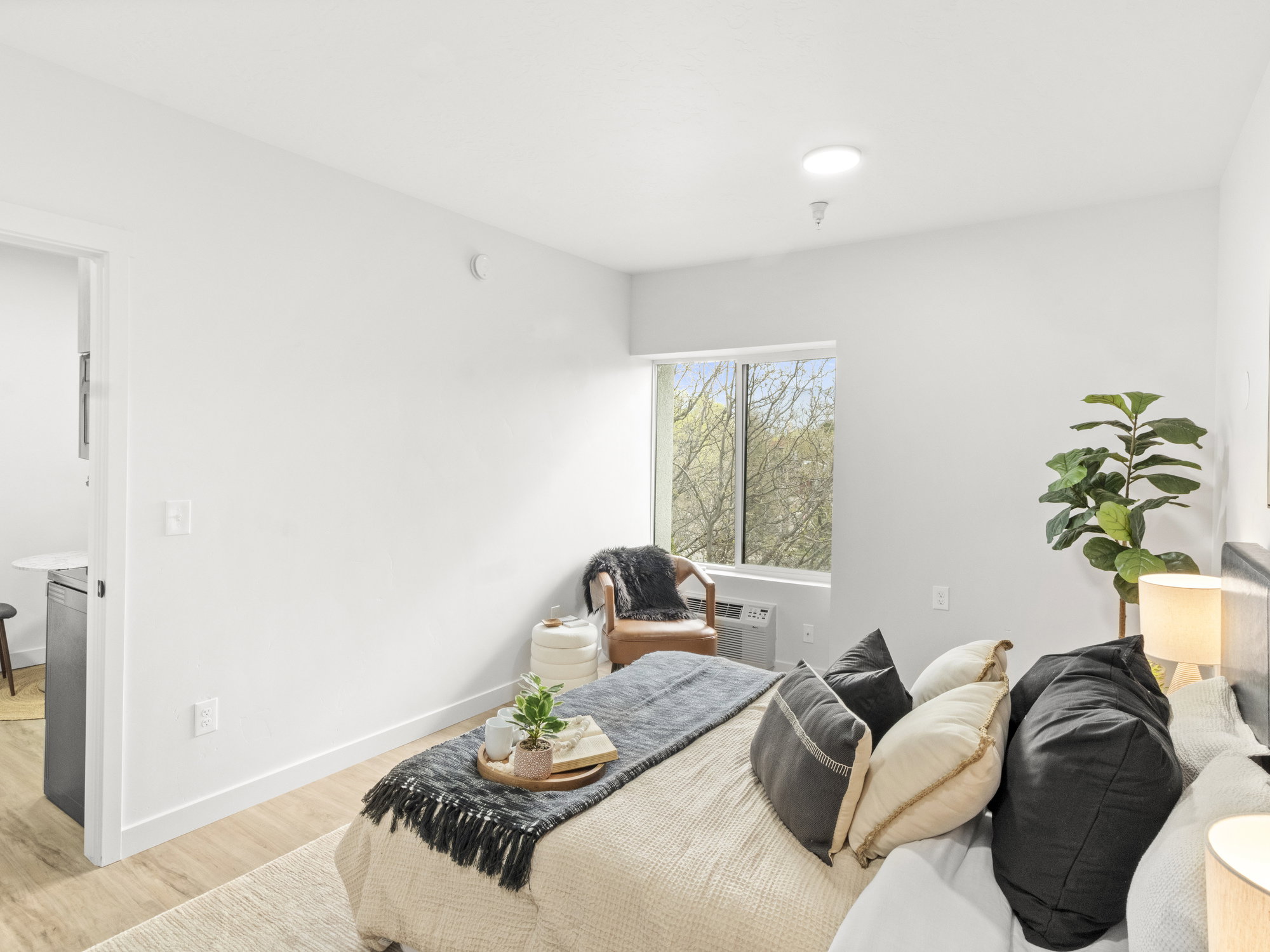 Bedroom with light wood-type flooring and baseboards