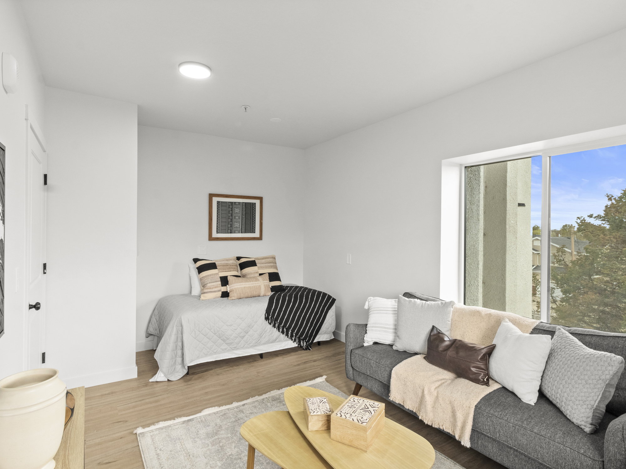 Bedroom featuring wood finished floors and baseboards