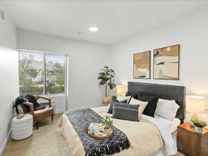 Bedroom featuring baseboards and wood finished floors