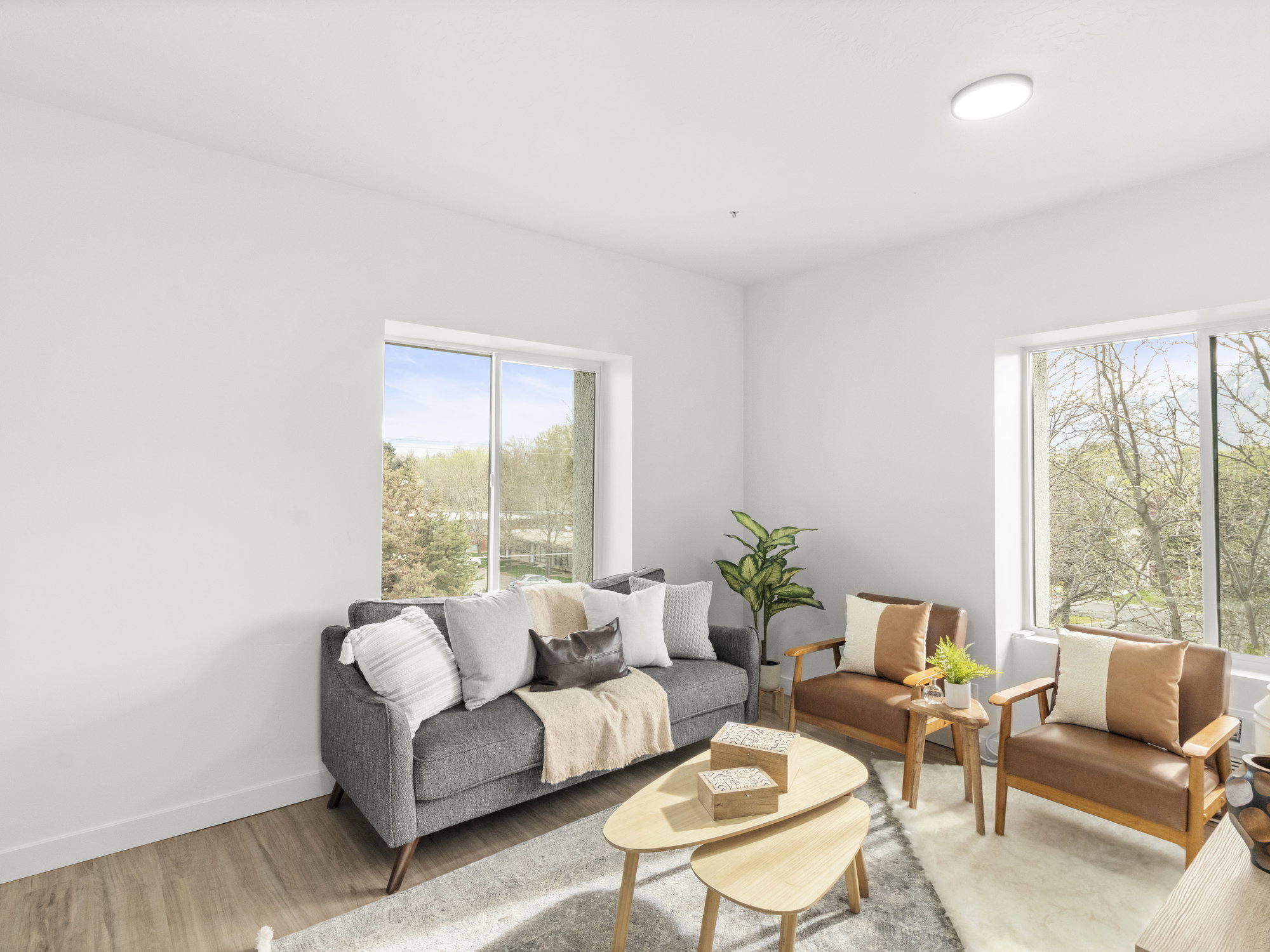 Living room featuring healthy amount of natural light and light wood-style flooring
