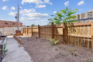 View of fenced backyard