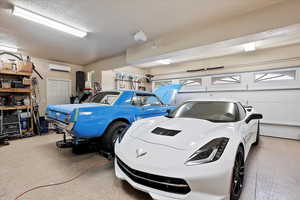 Garage featuring an AC wall unit