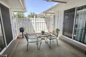 Patio with a grill and outdoor dining space