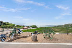 Communal playground featuring a mountain view