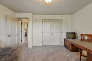 Home office featuring carpet