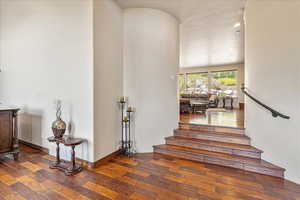 Stairs featuring hardwood / wood-style floors and recessed lighting