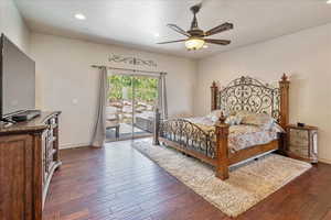 Bedroom featuring access to exterior, dark wood-style floors, recessed lighting, and a ceiling fan