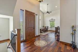 Foyer featuring hardwood / wood-style flooring, high vaulted ceiling, a ceiling fan, and recessed lighting