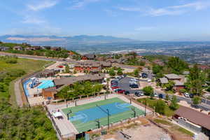 Aerial view of residential area featuring a mountainous background