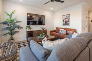 Living area with recessed lighting and a ceiling fan