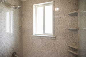 Full bathroom featuring tiled shower