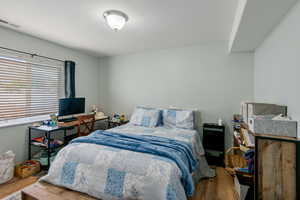 Bedroom with wood finished floors