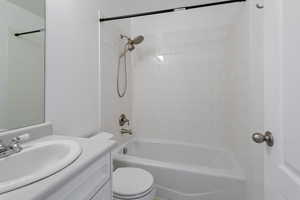 Bathroom with vanity and tub / shower combination