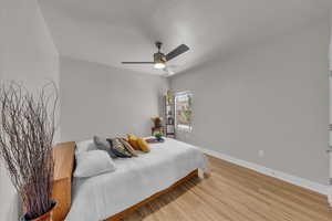 Bedroom featuring light wood-style floors and a ceiling fan