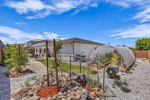 Rear view of property with a patio, a fenced backyard, and stucco siding