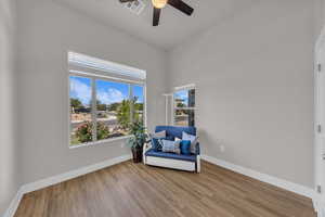 Unfurnished room featuring ceiling fan and wood finished floors