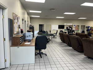Home office with light tile patterned flooring