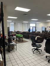 Office area with a paneled ceiling