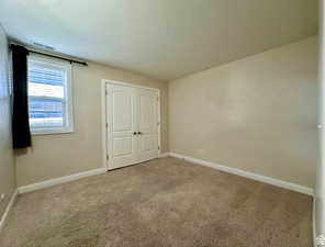 2nd Unfurnished bedroom featuring carpet floors