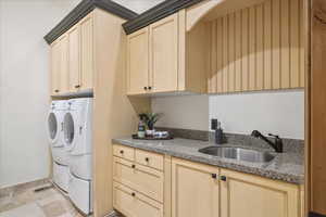 Laundry area with washing machine and dryer and cabinet space