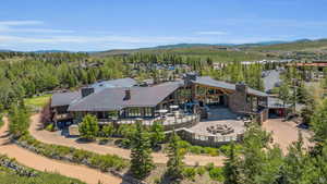 Aerial view of property and surrounding area with mountains