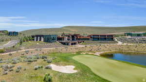 Aerial view of a golf club and a water and mountain view
