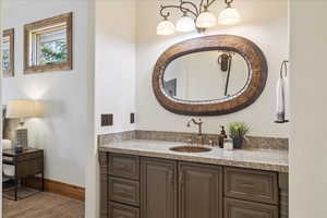 Bathroom with vanity and baseboards
