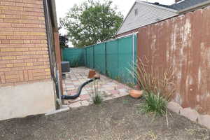 Fenced backyard featuring a patio area