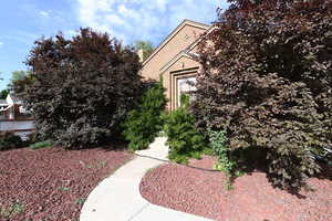 View of property exterior featuring a chimney