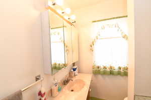 Half bath with vanity and toilet