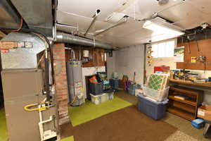 Below grade area with water heater and heating unit