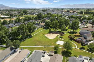 Aerial perspective of suburban area featuring a mountain backdrop