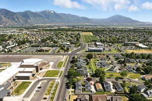 Aerial view of residential area featuring a mountainous background