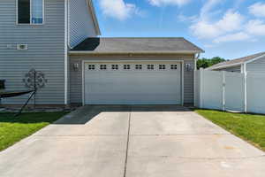 Garage featuring concrete driveway