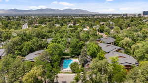 Bird's eye view of a pool area and a mountain backdrop