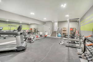 Workout area featuring recessed lighting