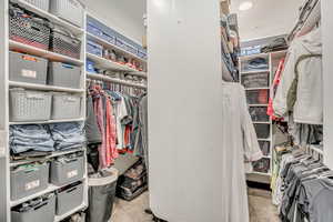 Spacious closet with carpet floors