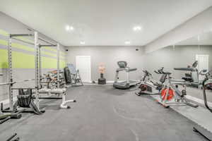 Workout area featuring baseboards