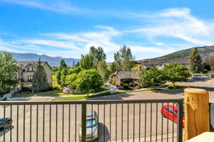 Balcony featuring a mountain view and a residential view