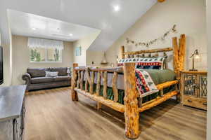 Bedroom featuring wood finished floors and recessed lighting