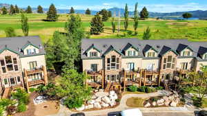 Drone / aerial view of mountains and a local golf course