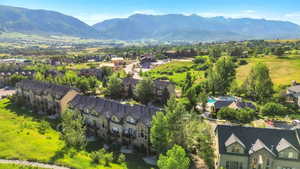 Aerial view of residential area featuring a mountainous background