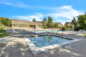 Community pool featuring a patio area