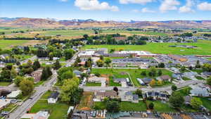 View of property location with a mountainous background and nearby suburban area
