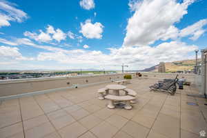 Rooftop patio with city & mountain views