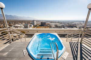 Rooftop pool/hot tub with view of the city