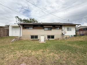 Rear view of house with brick siding