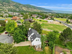 Aerial view of residential area featuring a mountainous background
